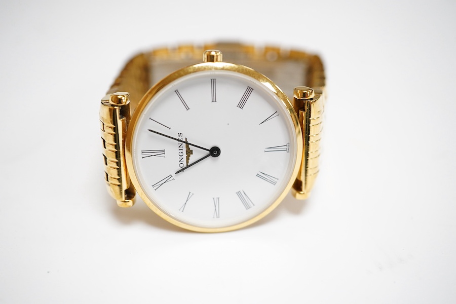 A lady's steel and gold plated Longines Le Grande Classique quartz wrist watch, white dial, case diameter 30mm, flexible link bracelet, boxed with papers.